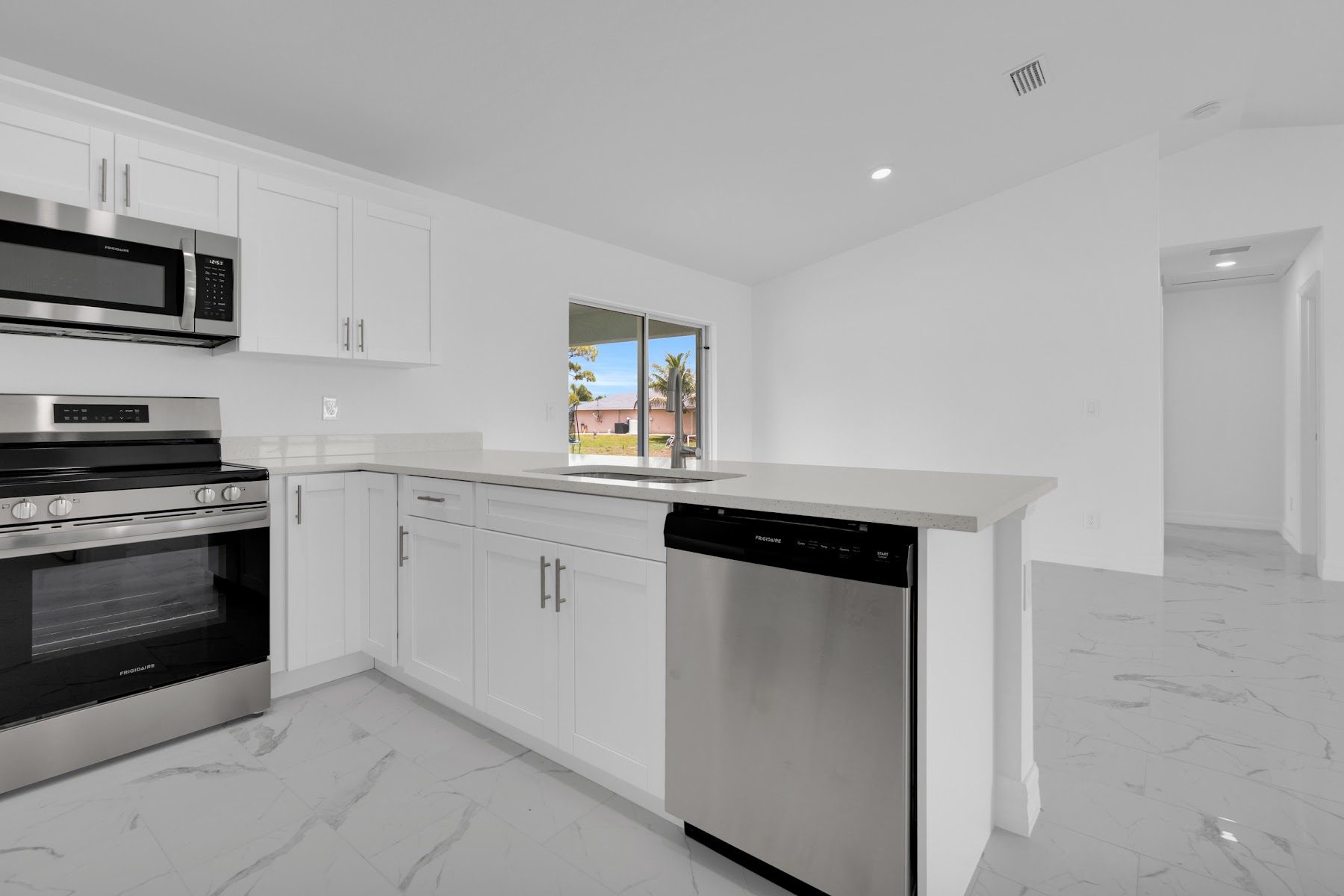 Bright kitchen and living area inside an AVD home